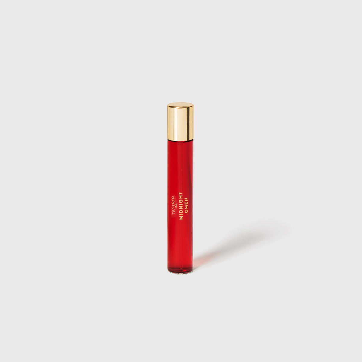 Small red perfume bottle, golden cap