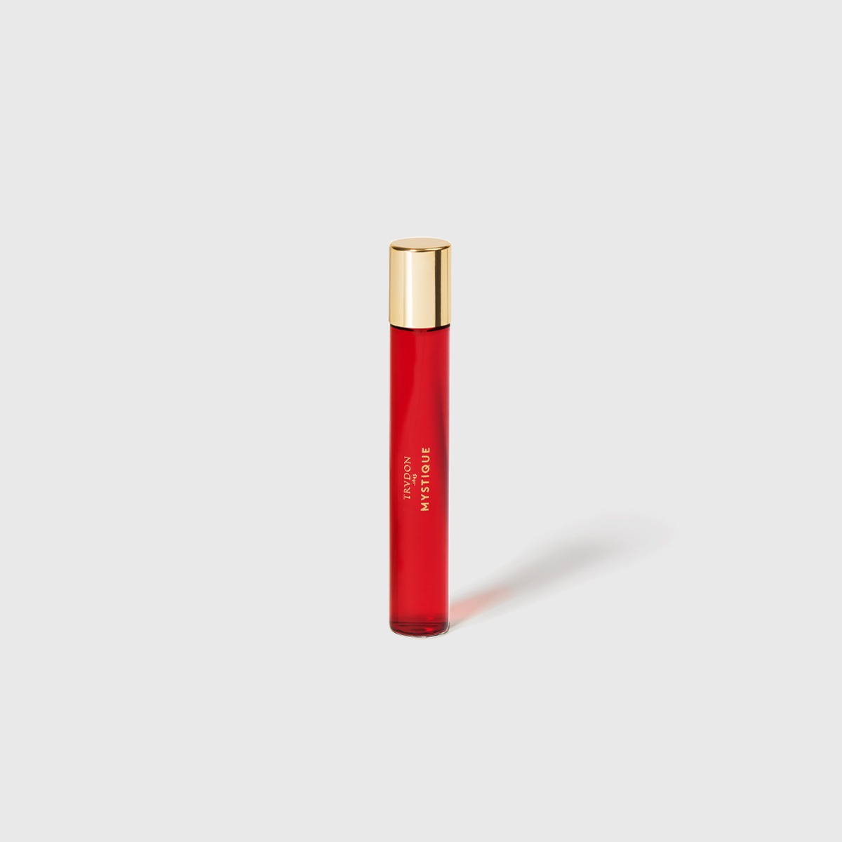 Small red perfume bottle with golden cap